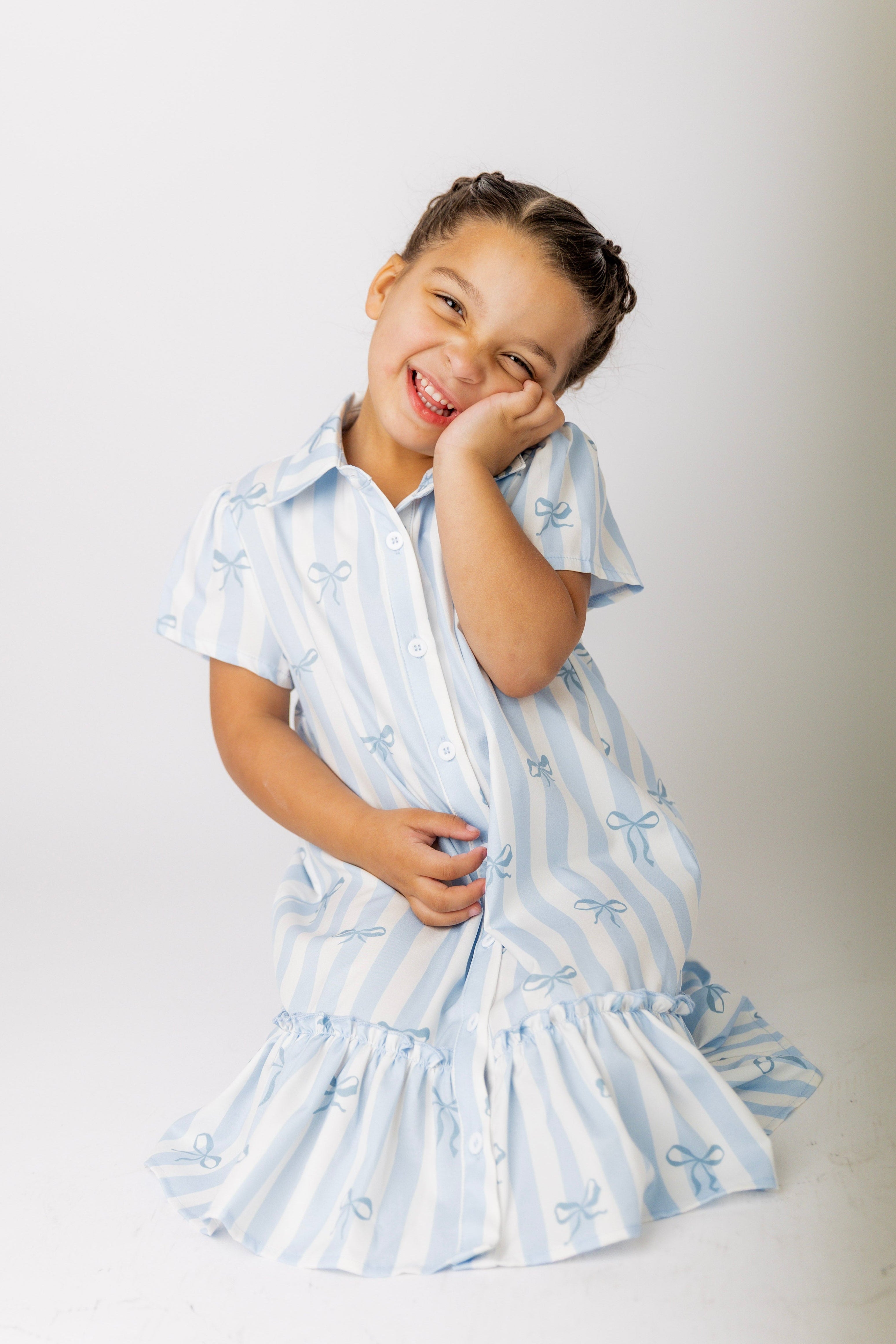 Model wearing Nuggles® Girls' Ellie Dress Dress in Sweet Ribbon Stripe