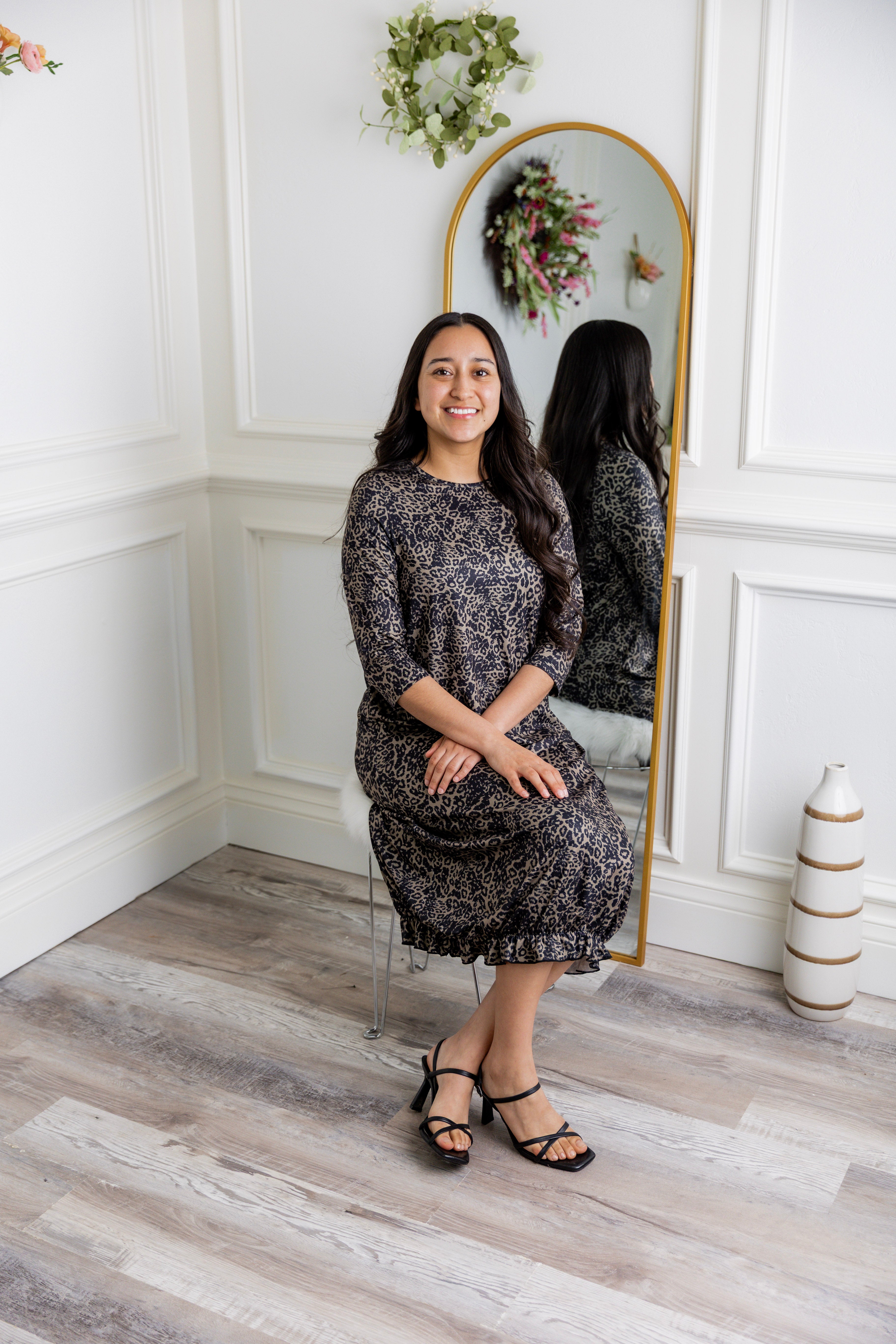 Model wearing our Nuggles® modest Bristol midi dress with 3/4 sleeves and elastic ruffle hem in various prints.