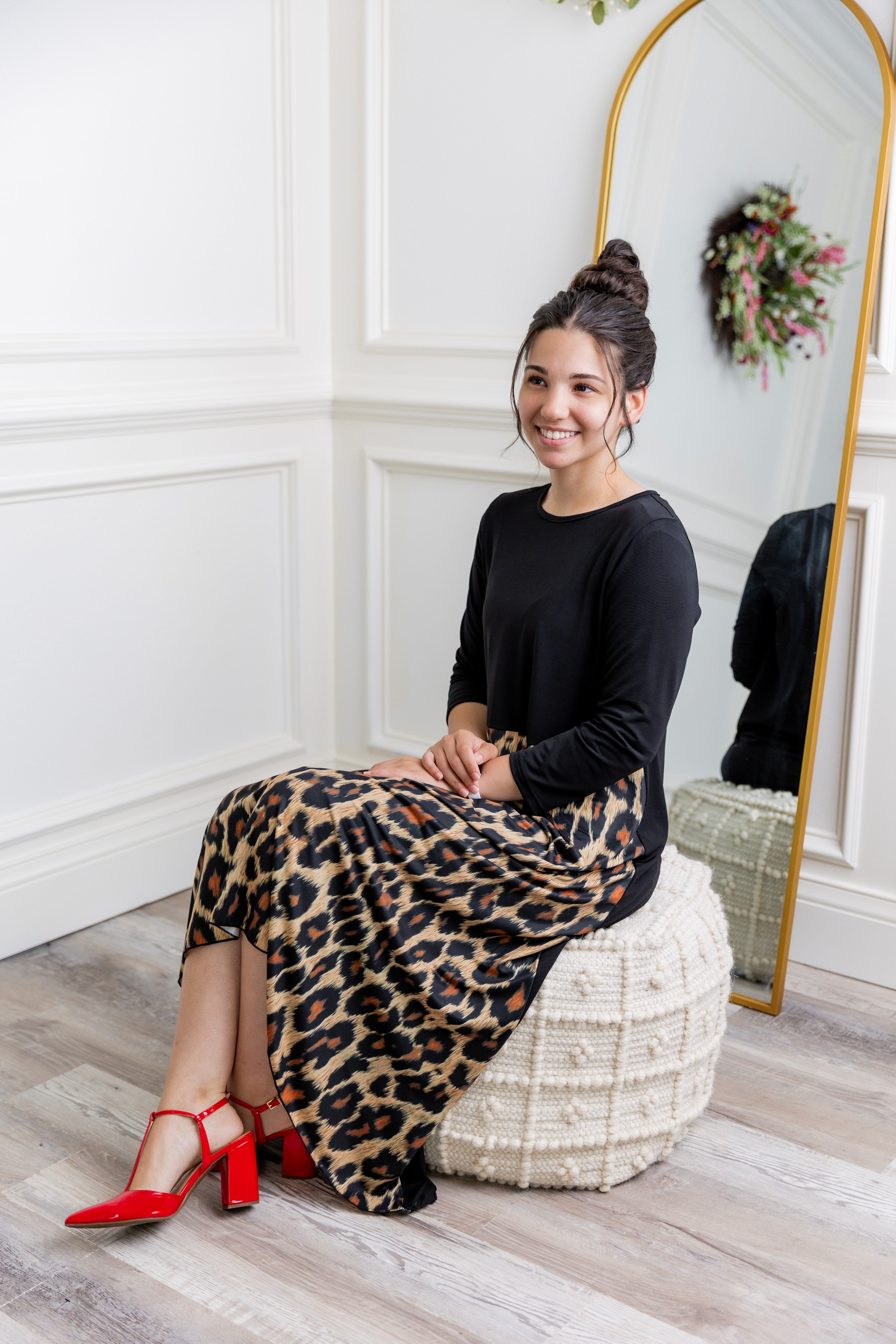 Model modeling Nuggles® Charay Dress with ¾ sleeves and high-low hem. Modest and stylish A-line dress with flattering fit.