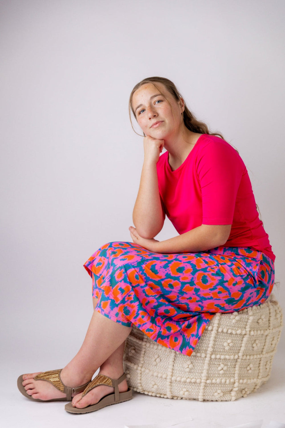 Model wearing the Nuggles® Essential Half Sleeve Tee in Hot Pink