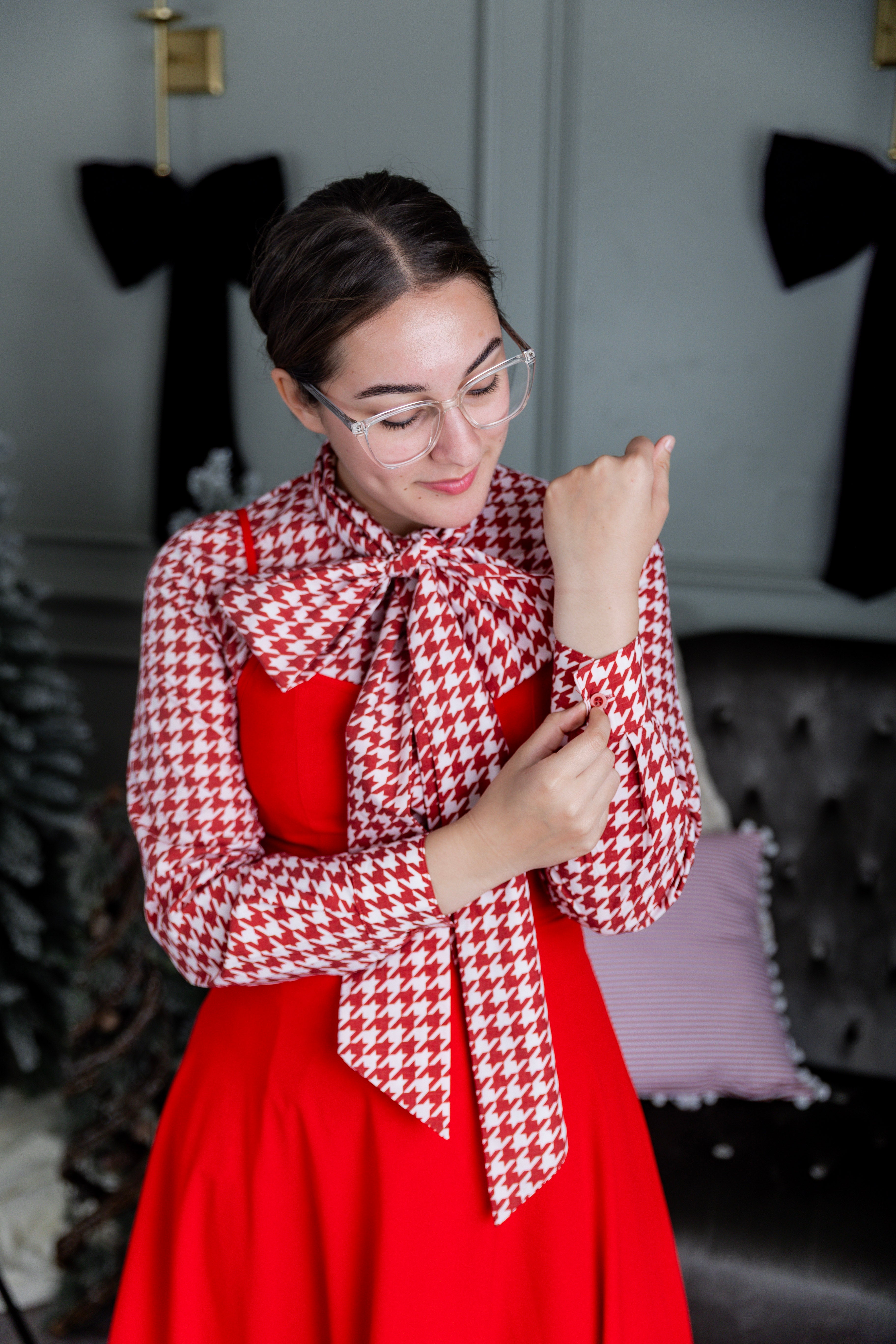 Model wearing Nuggles® Felicity top with large bow tie neckline, modest women's blouse.