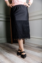 Model wearing our modest Nuggles® 27" crochet lace slip in Black