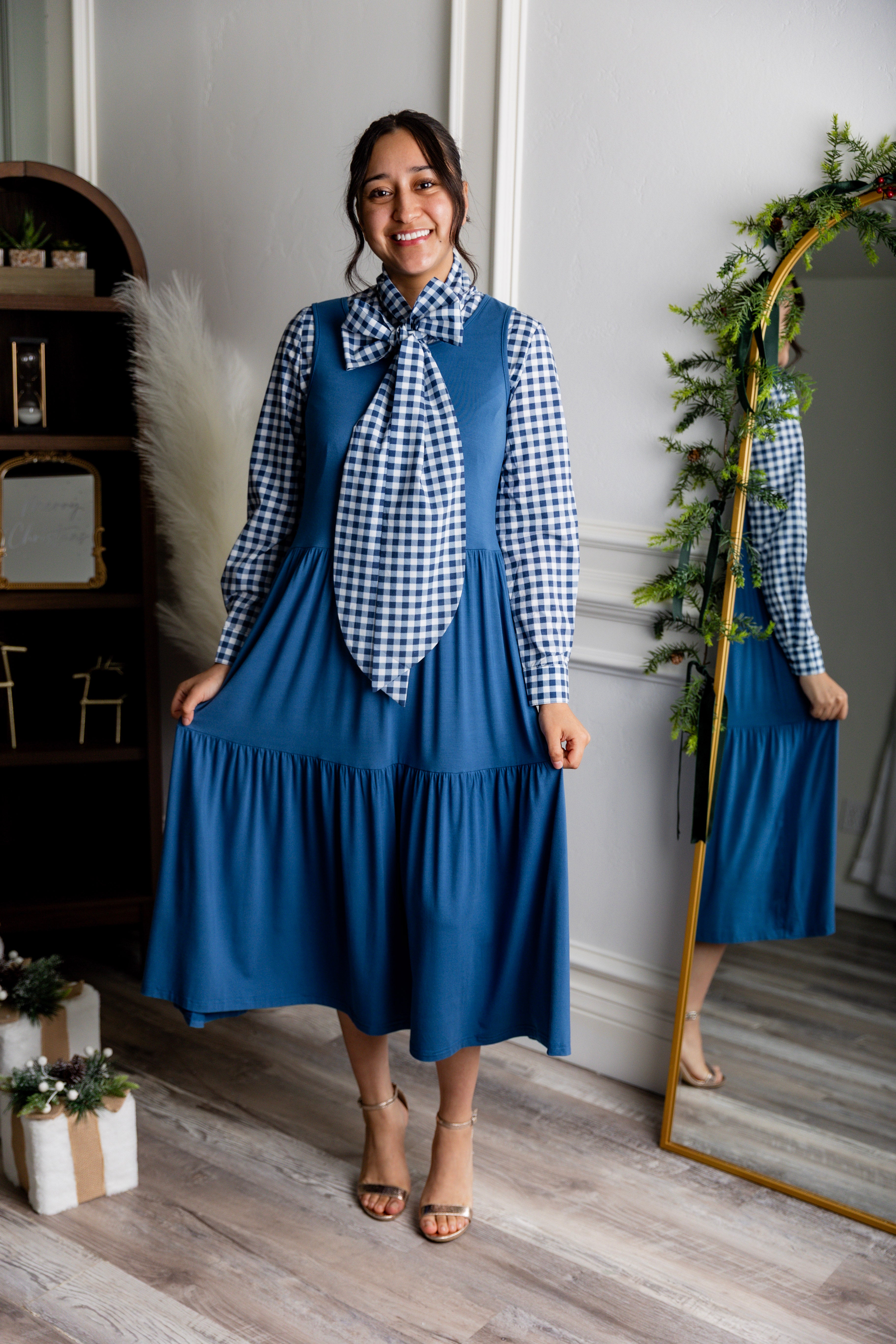 Model wearing Nuggles® Felicity top with large bow tie neckline, modest women's blouse.