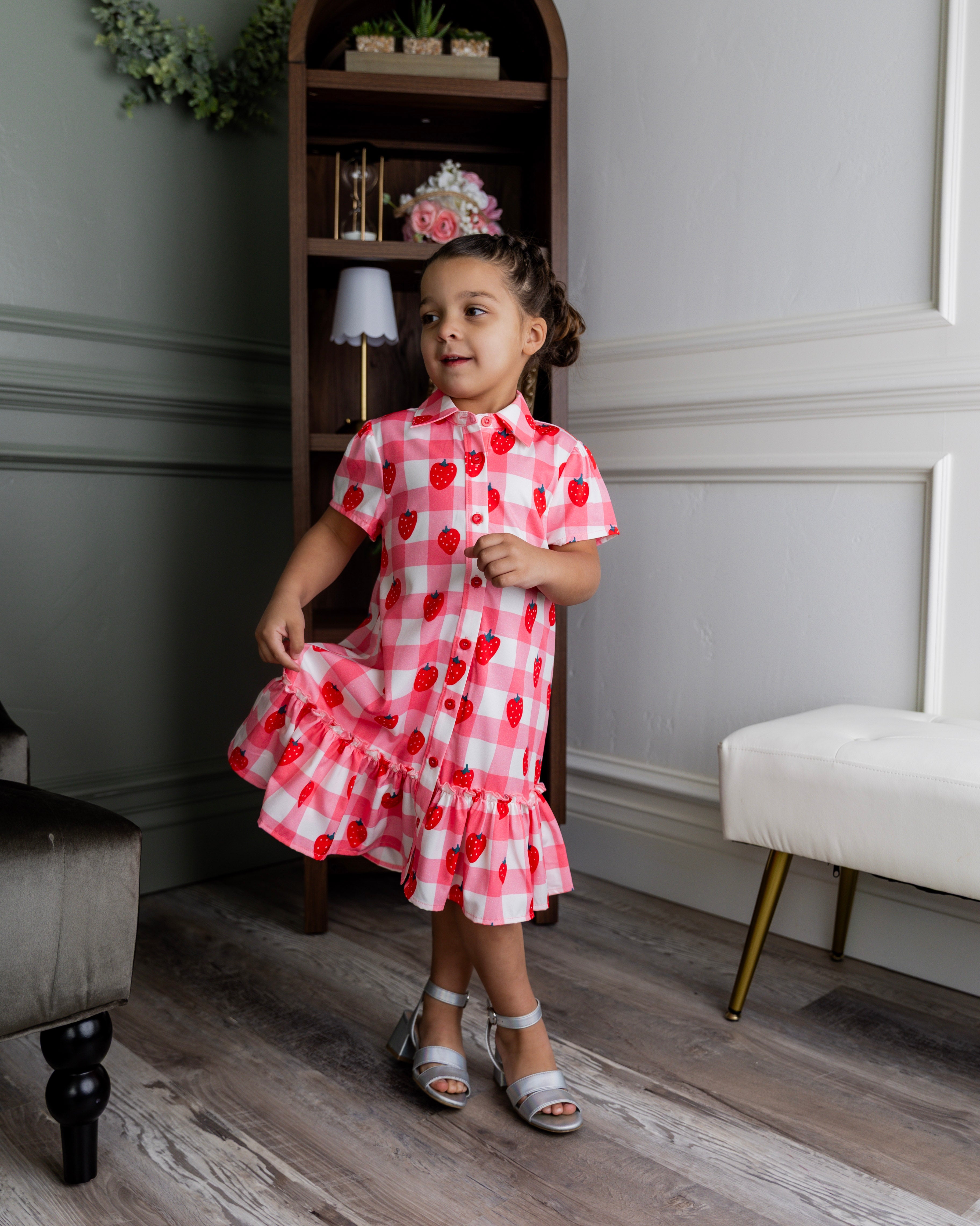 Model wearing Nuggles® Girls' Ellie Dress Dress in Strawberry Sweetheart