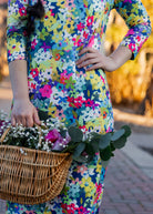 Model wearing the Nuggles® Original Midi Layering Dress in Wildflower Haze