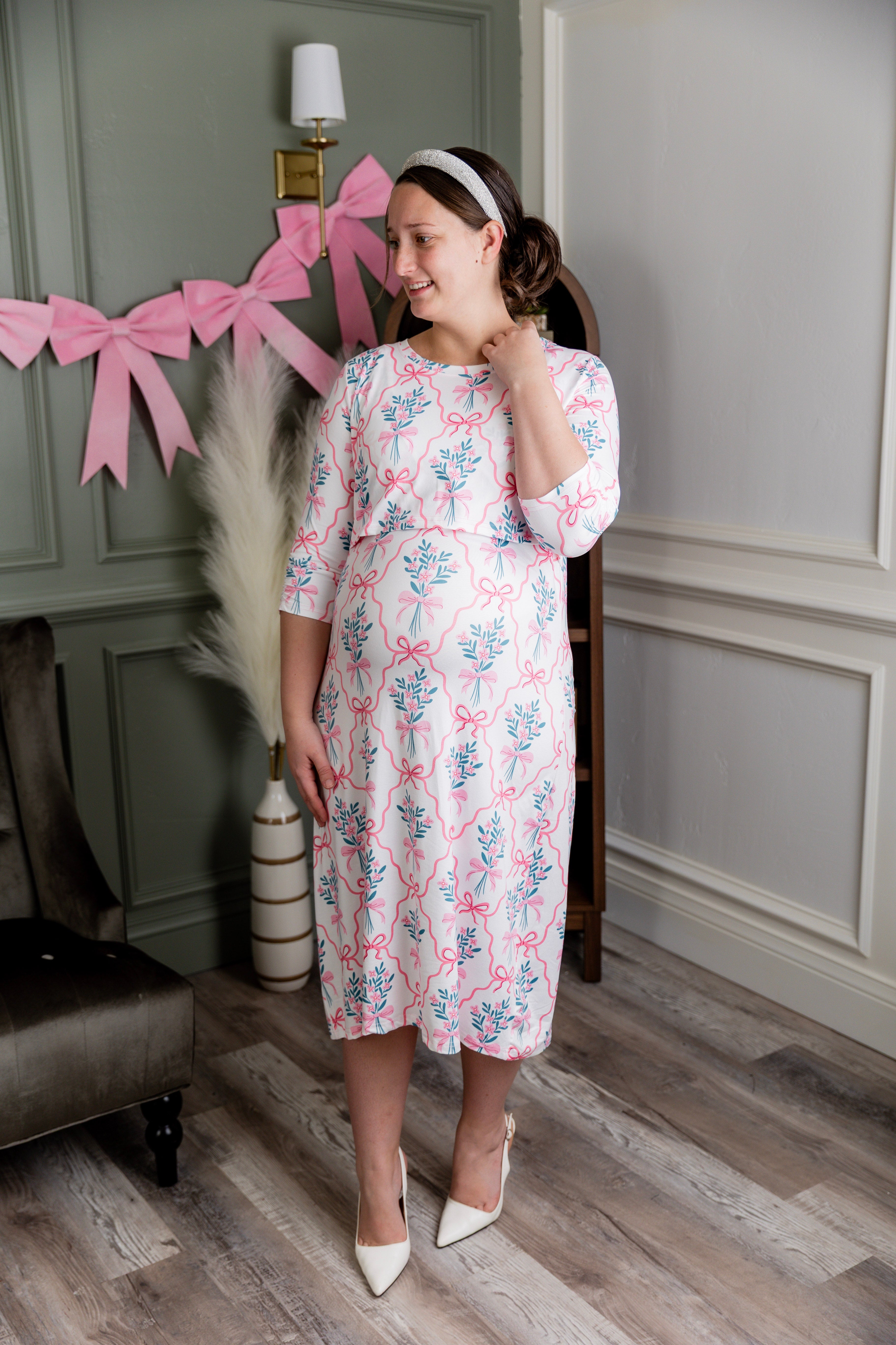 Model wearing Nuggles® Nalani Nursing Dress in Pixie Petals 