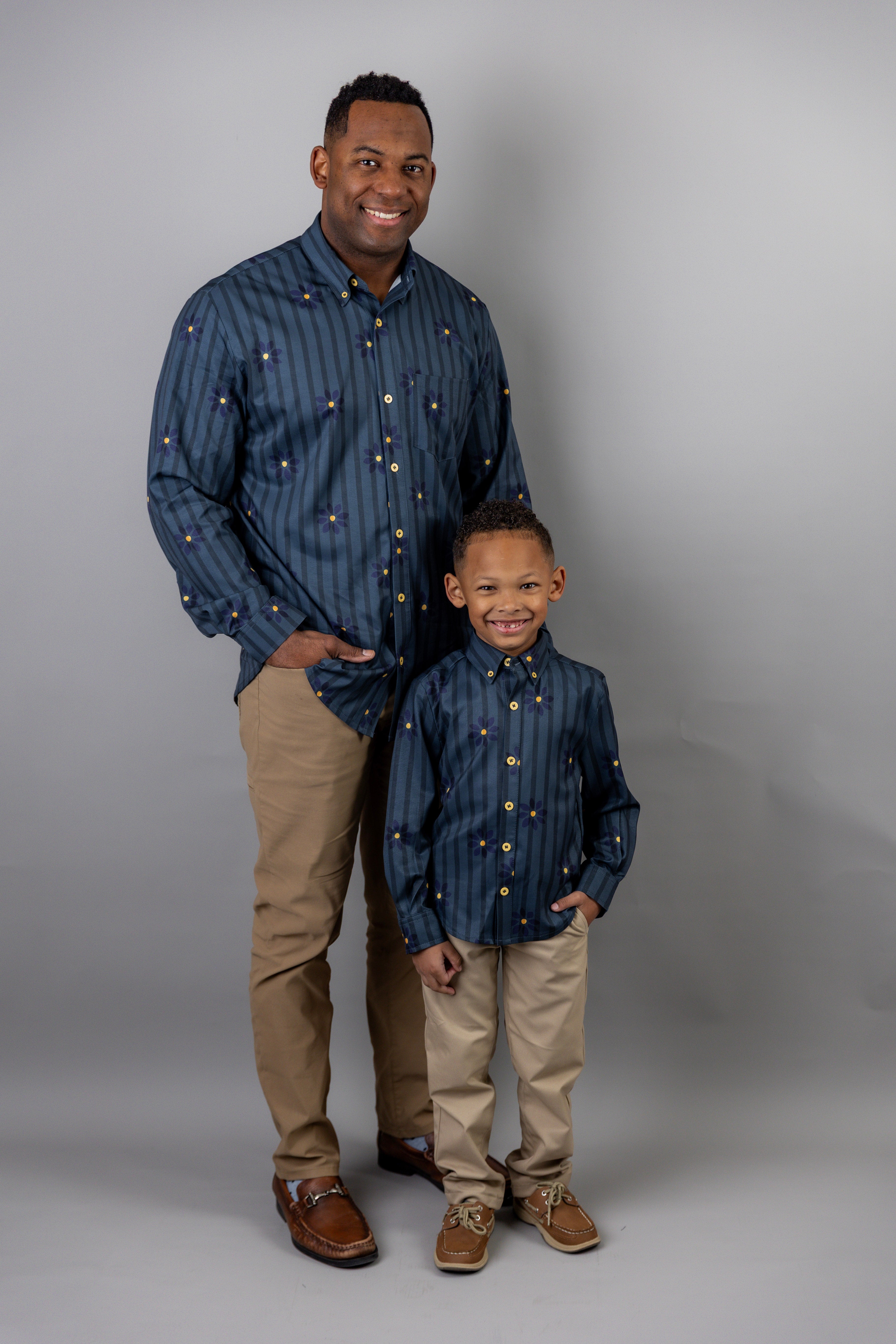 Model wearing Nuggles® Boy's Button Down Shirt in Pinstripe Ditsy