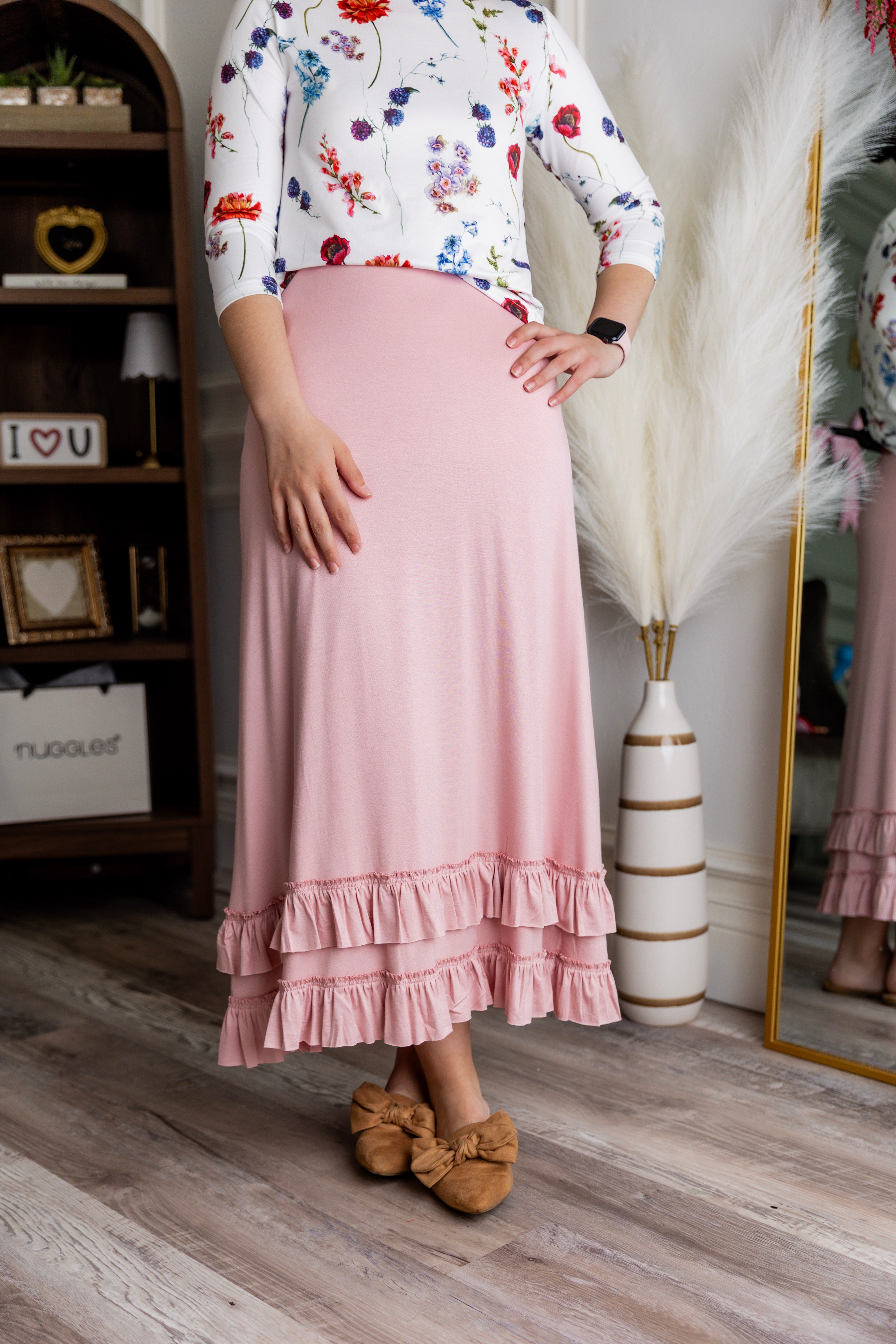 Model wearing Nuggles® Callie Skirt in Baby Pink modest skirt