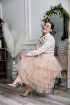 Model wearing Nuggles® Felicity top with large bow tie neckline, modest women's blouse.