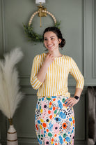 Model wearing Nuggles® 3/4 Essential Tee in Lemon Drop Stripe