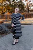 Modest high and low dress with ruffle sleeves and contrasting prints