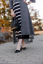 Modest high and low dress with ruffle sleeves and contrasting prints