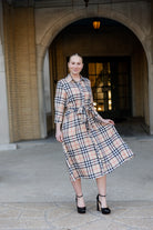 Model wearing the Nuggles® Rachel Dress in Sand Plaid