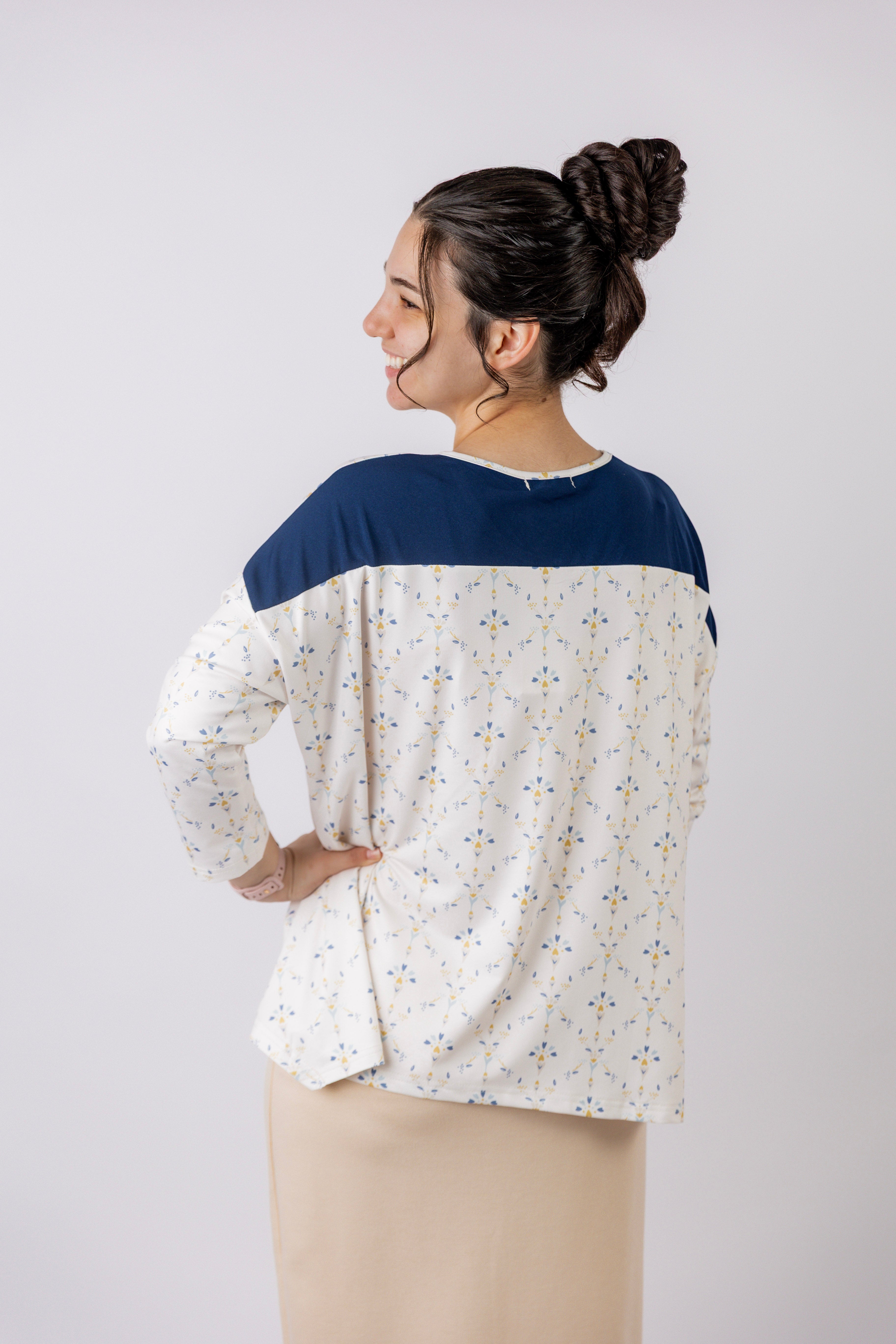 Model wearing the Nuggles® Keegan Top in Dewdrop Ivory floral print modest boutique top