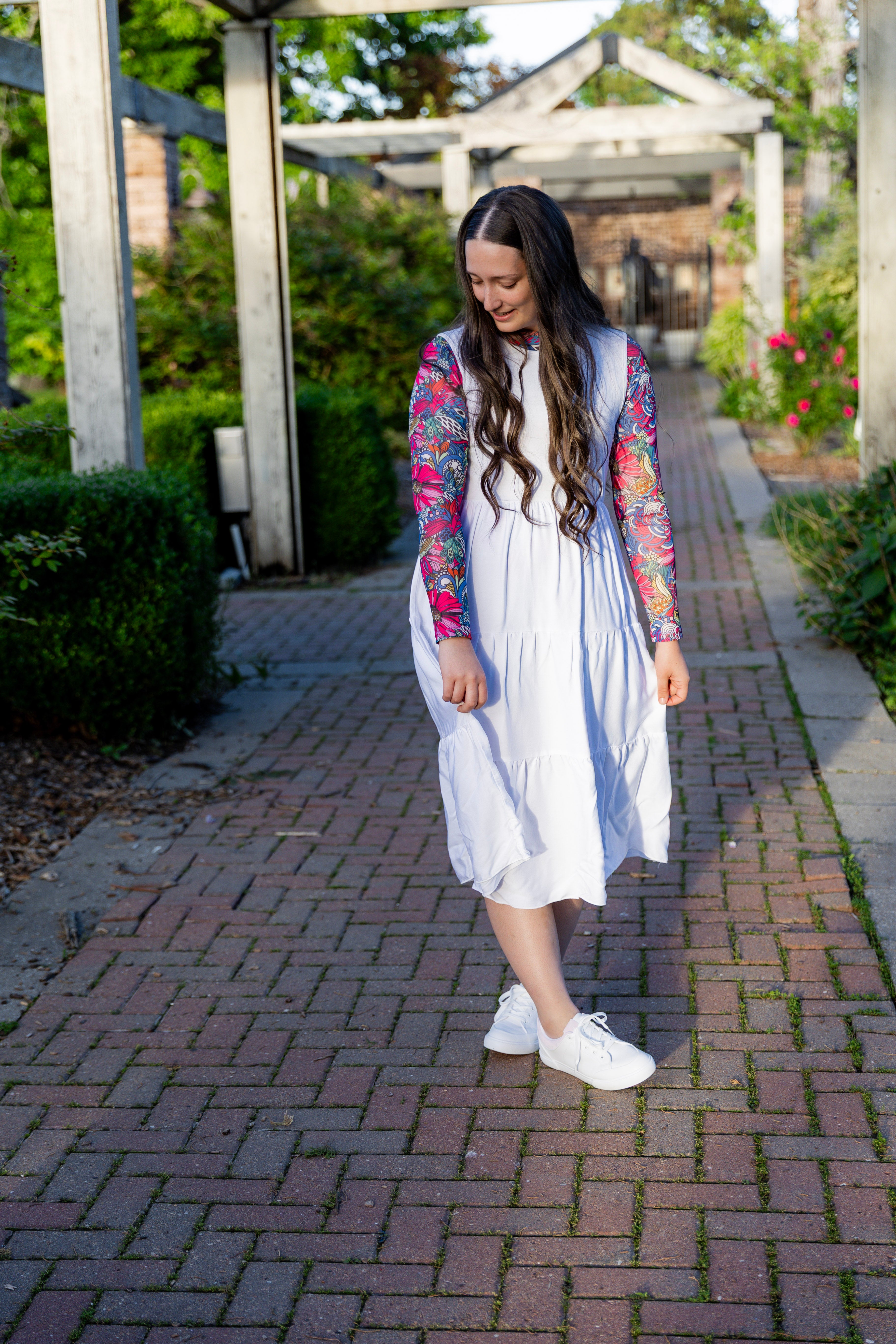 Modest sleeveless midi dress with tiered skirt and fitted bodice, styled for layering with a crew neckline – Hannah Layering Dress by Nuggles®.