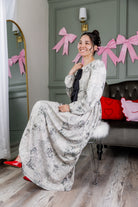 Model wearing the Nuggles® Addison Dress in Whispering Headlines