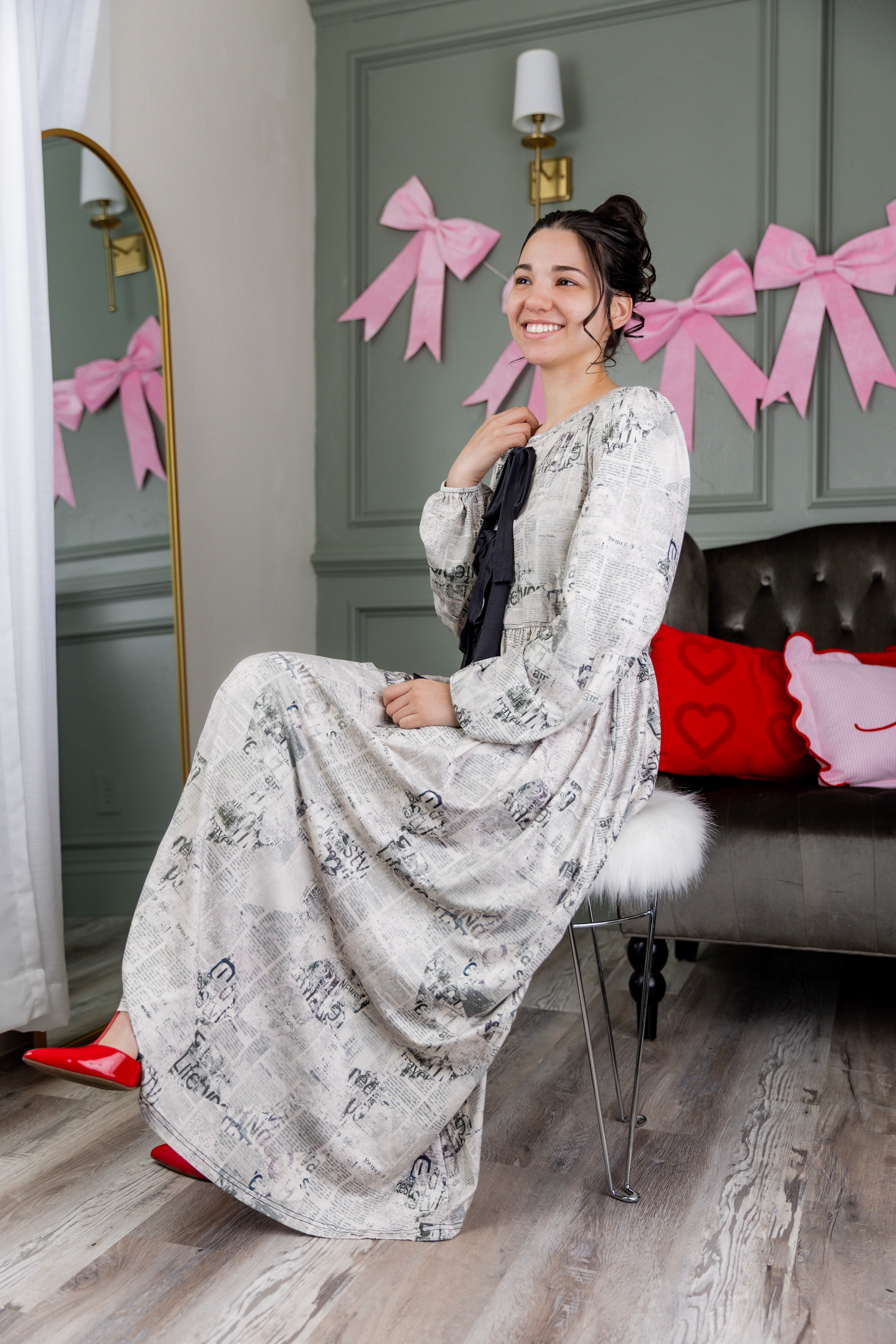 Model wearing the Nuggles® Addison Dress in Whispering Headlines