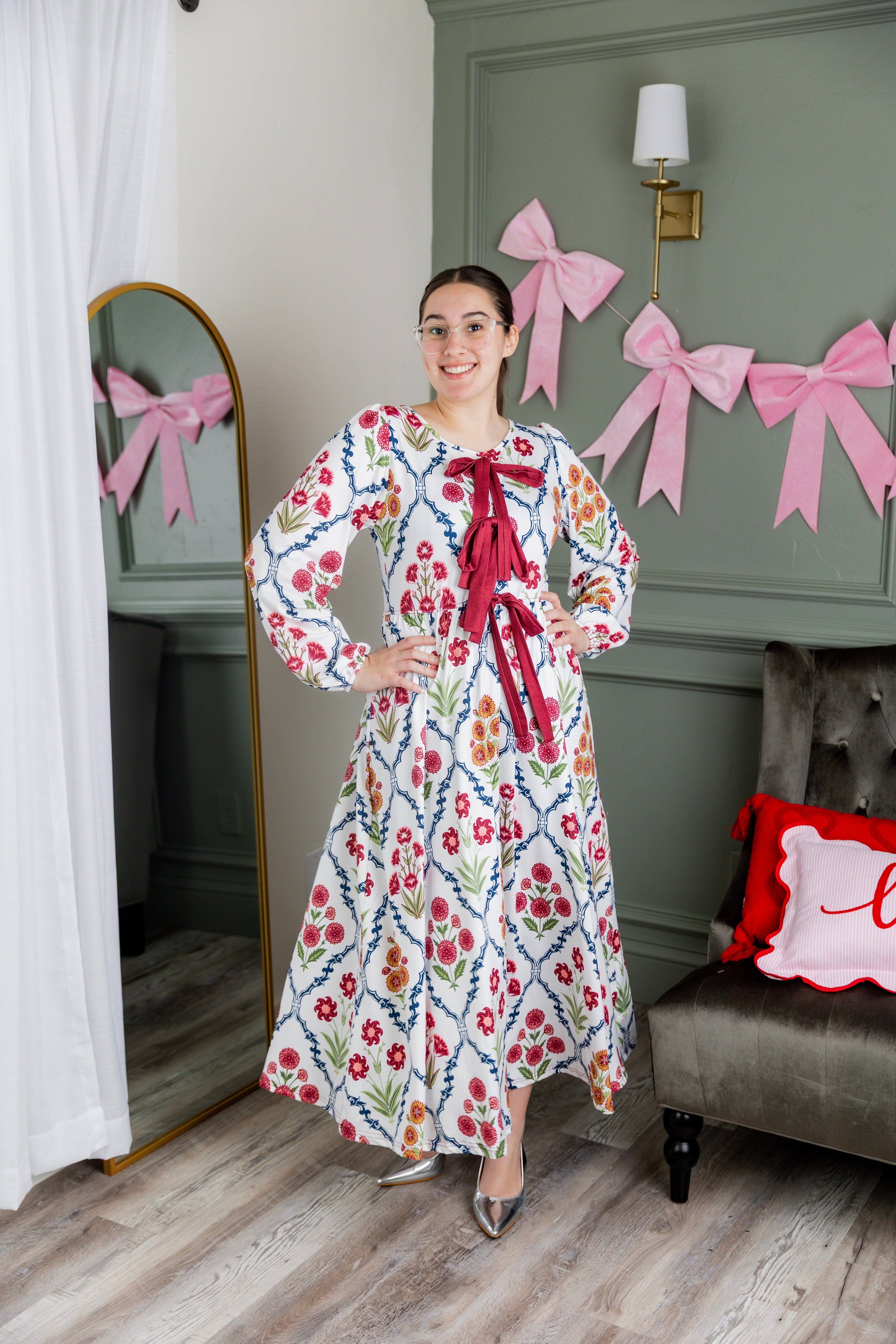 Model wearing the Nuggles® Addison Dress in Wildflower Trellis