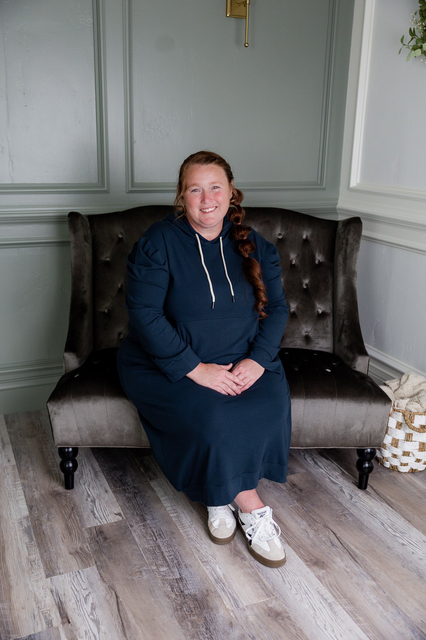 Model wearing Nuggles® Zoelle Dress in solid color, modest hoodie dress with puff sleeves.