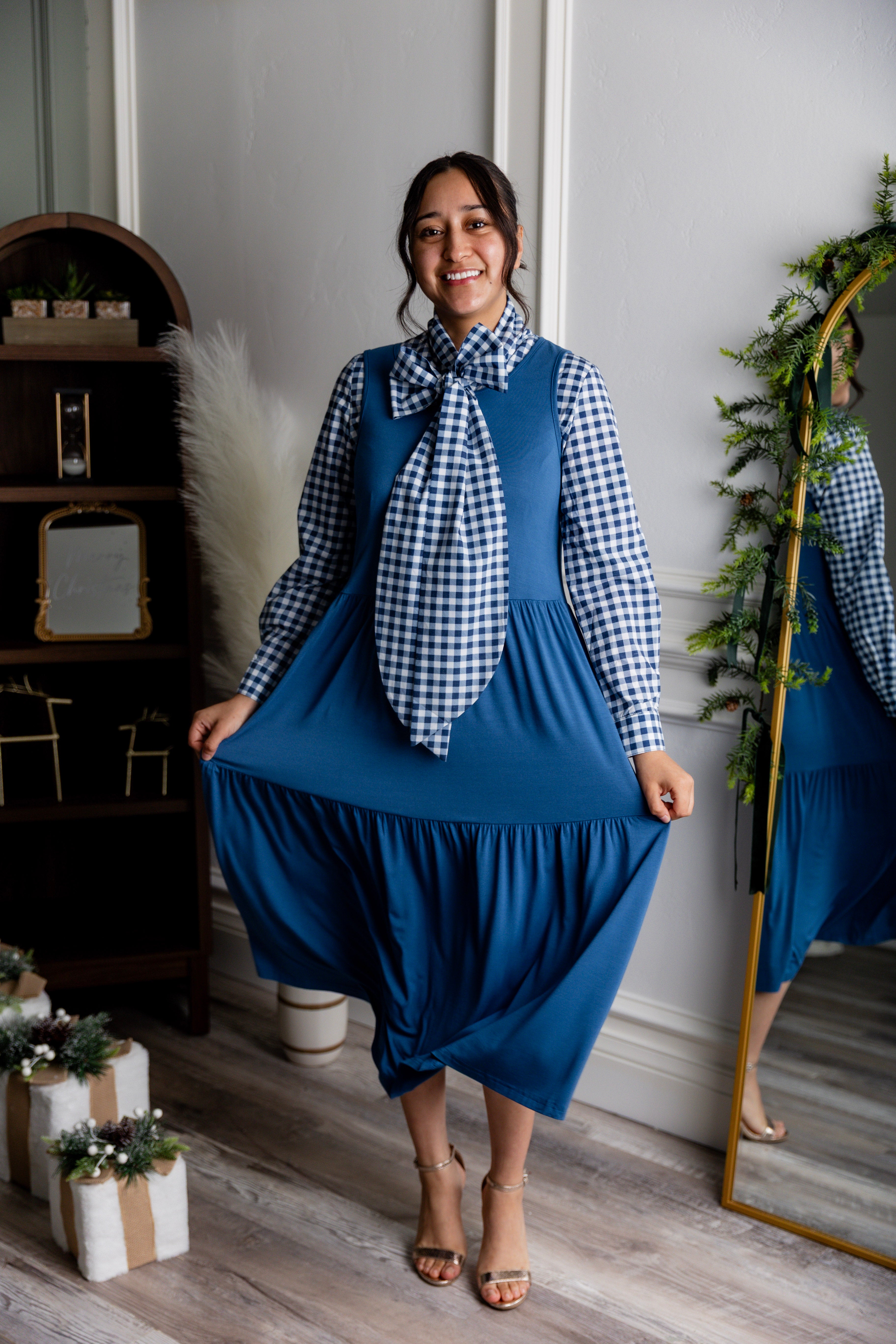 Model wearing Nuggles® Felicity top with large bow tie neckline, modest women's blouse.