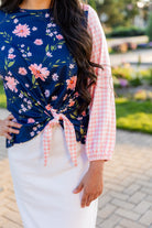 modest long sleeve top with a tie knot and contrasting knit fabrics