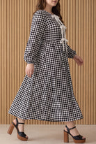 Model wearing Nuggles®  Addison Dress in Cookie Check