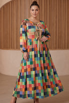 Model wearing Nuggles®  Addison Dress in Patch Pixels
