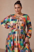 Model wearing Nuggles®  Addison Dress in Patch Pixels
