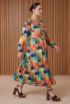 Model wearing Nuggles®  Addison Dress in Patch Pixels
