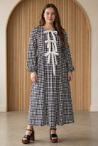 Model wearing Nuggles®  Addison Dress in Cookie Check