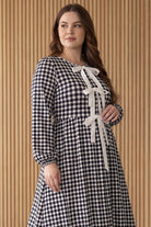 Model wearing Nuggles®  Addison Dress in Cookie Check