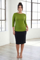 Model wearing Nuggles® 3/4 Essential Tee in Avocado
