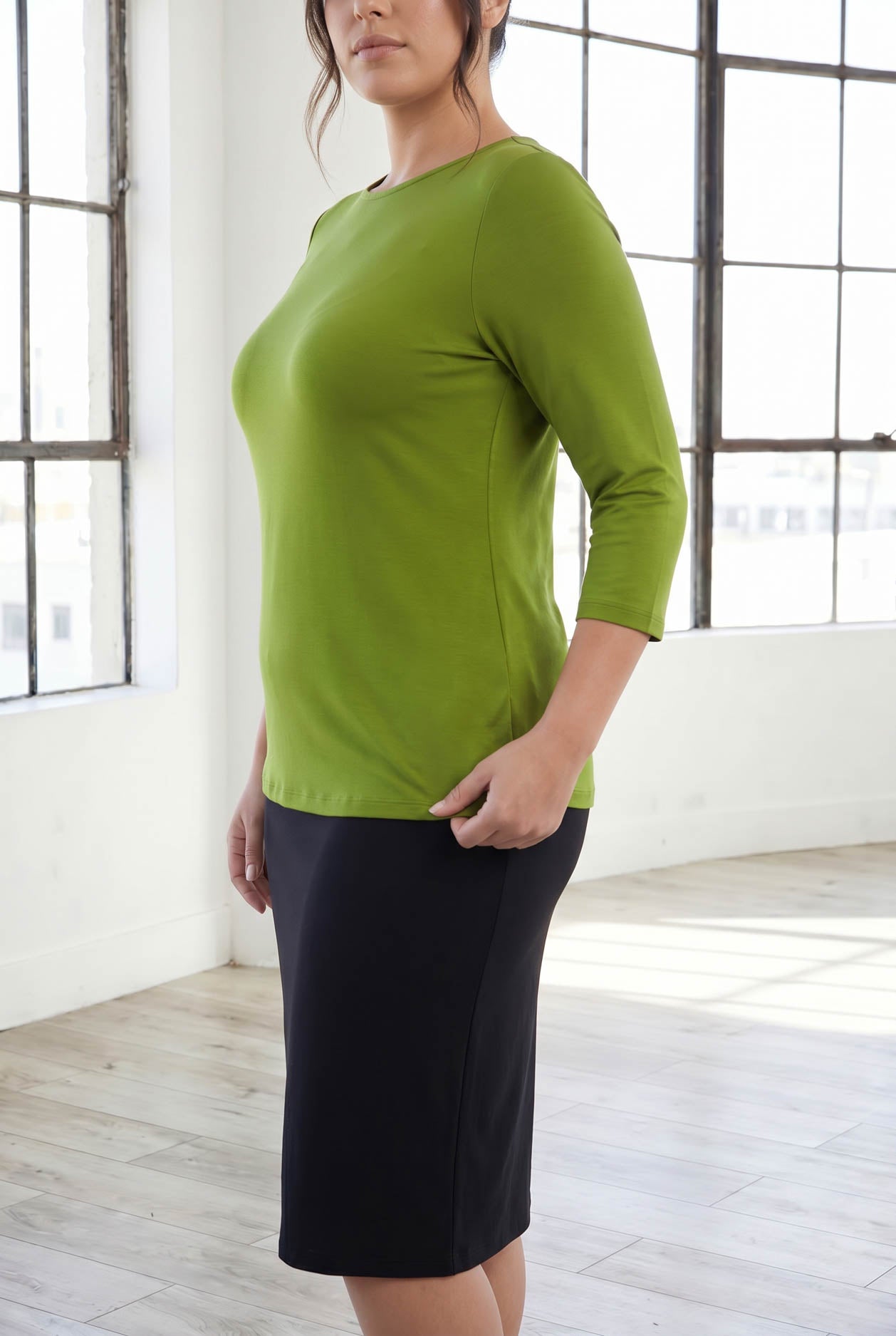 Model wearing Nuggles® 3/4 Essential Tee in Avocado