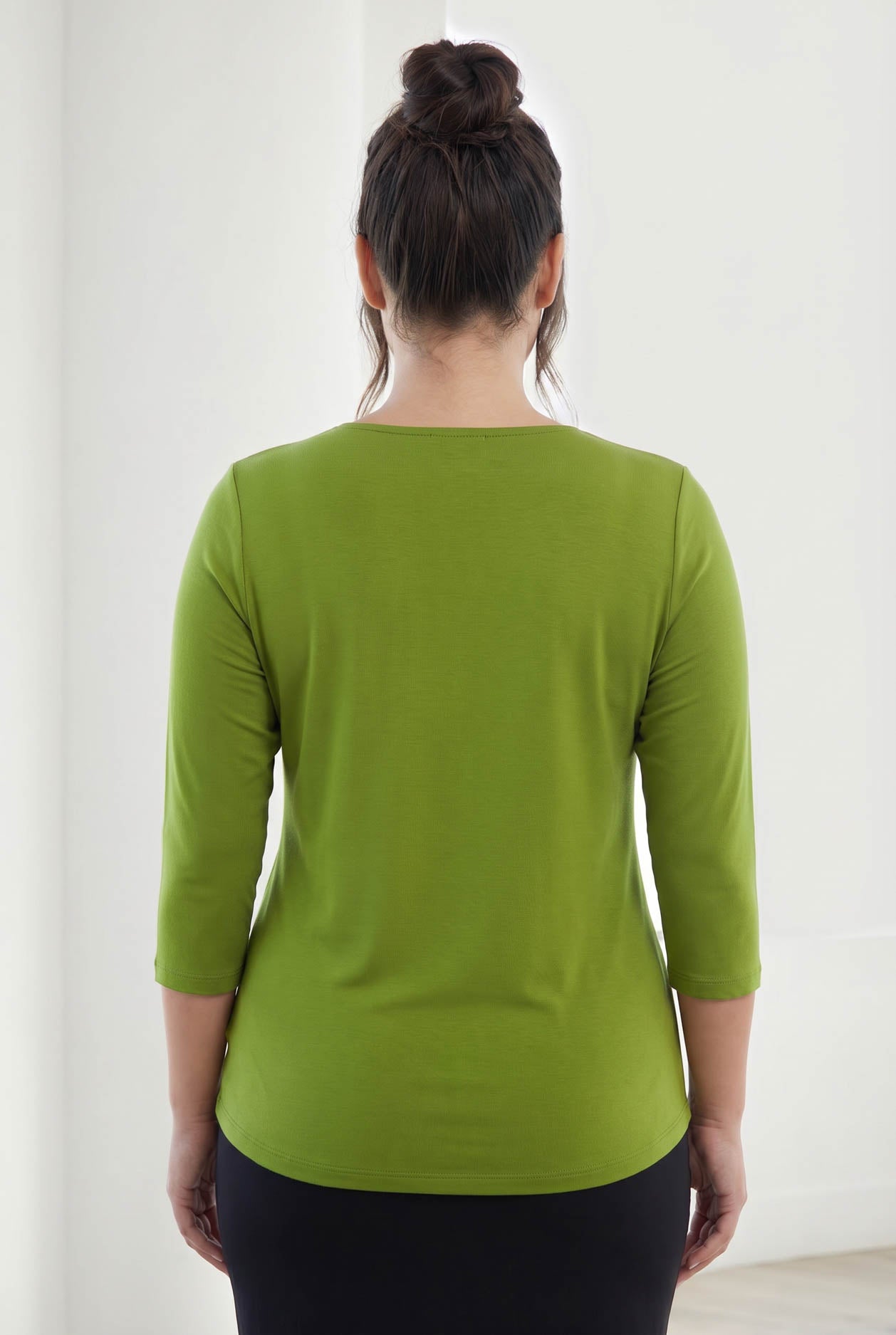 Model wearing Nuggles® 3/4 Essential Tee in Avocado
