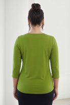 Model wearing Nuggles® 3/4 Essential Tee in Avocado