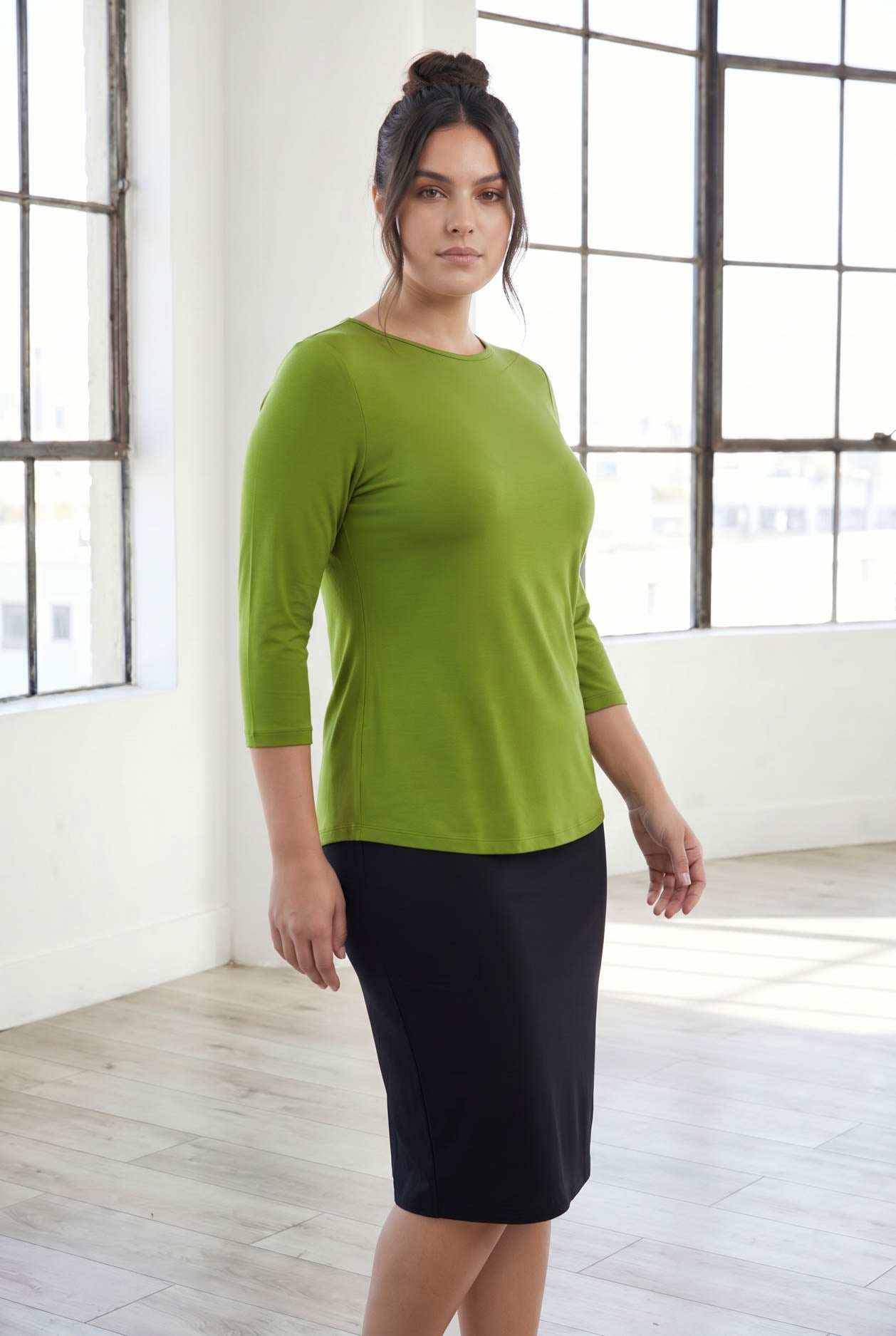 Model wearing Nuggles® 3/4 Essential Tee in Avocado