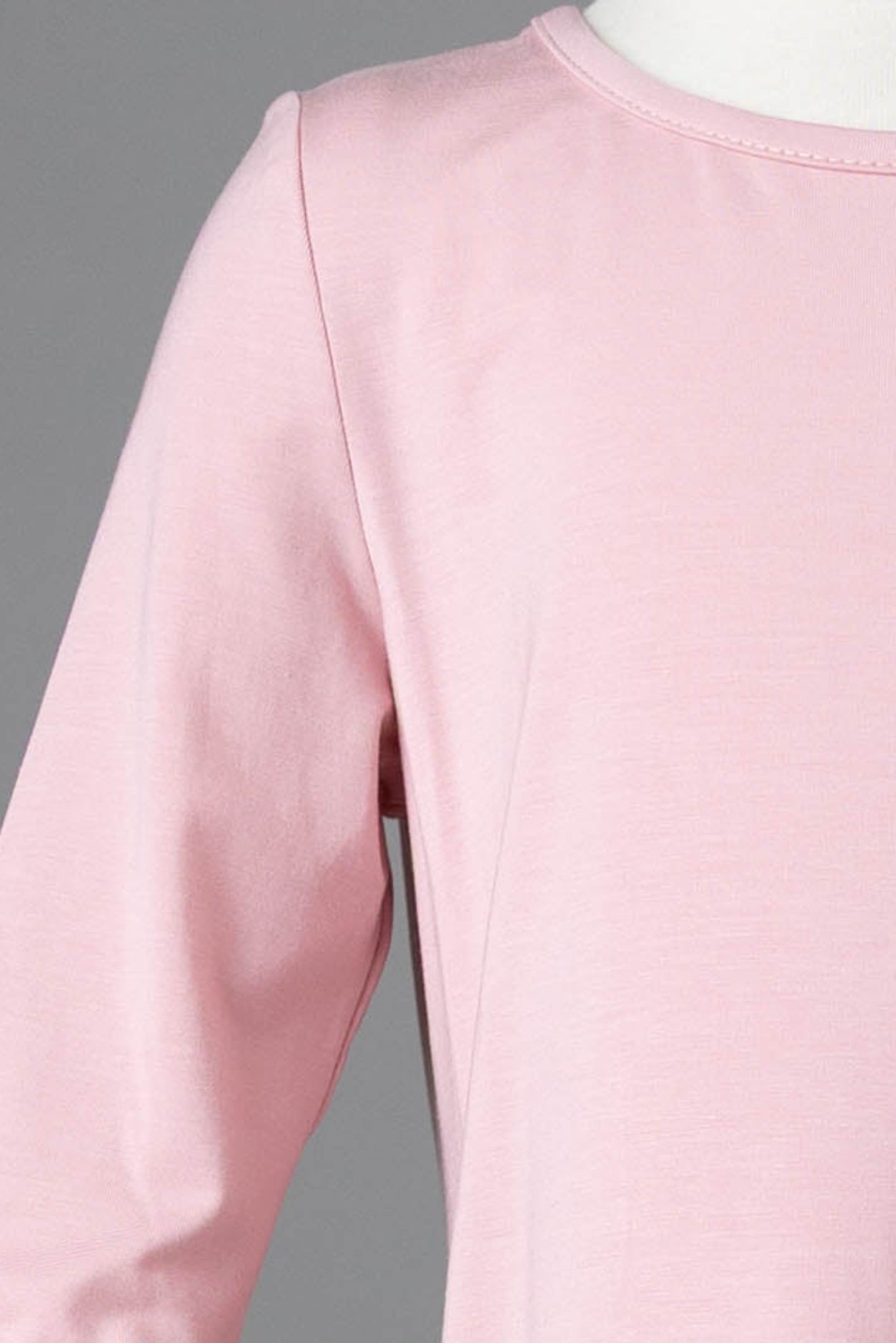 Model wearing Nuggles® Girls Midi Layering Dress in Baby Pink