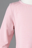 Model wearing Nuggles® Girls Midi Layering Dress in Baby Pink