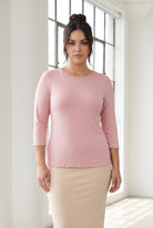 Model wearing Nuggles® 3/4 Essential Tee in Baby Pink