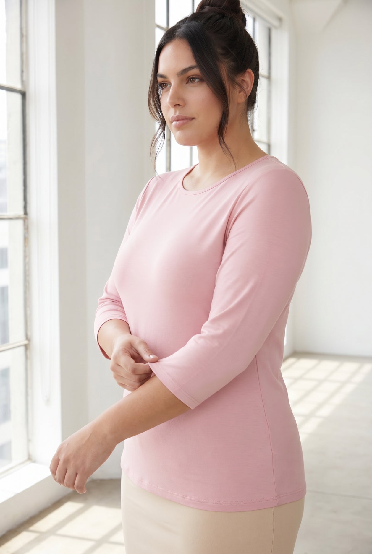 Model wearing Nuggles® 3/4 Essential Tee in Baby Pink
