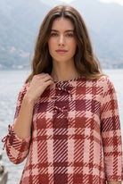 Model wearing Nuggles® Lexi Bow Top in Berry Paid
