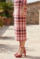 Model wearing Nuggles® 31" Lexi Skirt in Berry Plaid