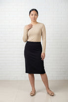 Model wearing Nuggles® 25" Relaxed Midi Skirt in Black