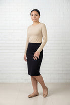 Model wearing Nuggles® 25" Relaxed Midi Skirt in Black