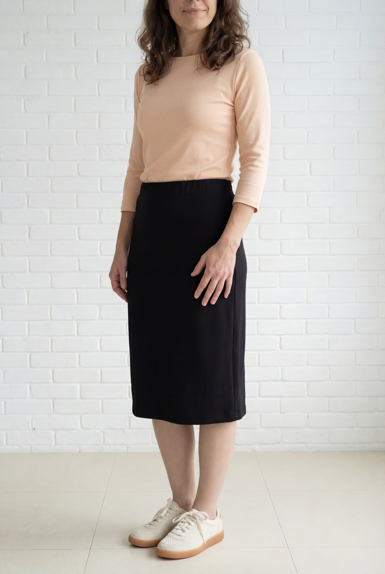 Model wearing Nuggles® 27" Relaxed Midi Skirt in Black