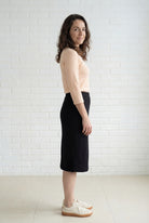 Model wearing Nuggles® 27" Relaxed Midi Skirt in Black
