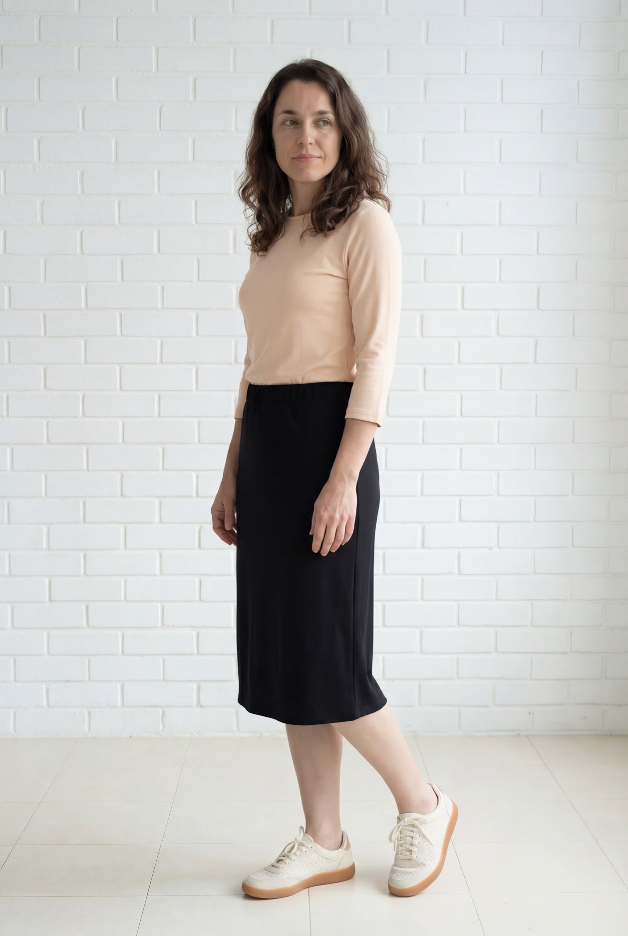 Model wearing Nuggles® 27" Relaxed Midi Skirt in Black