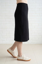 Model wearing Nuggles® 27" Relaxed Midi Skirt in Black