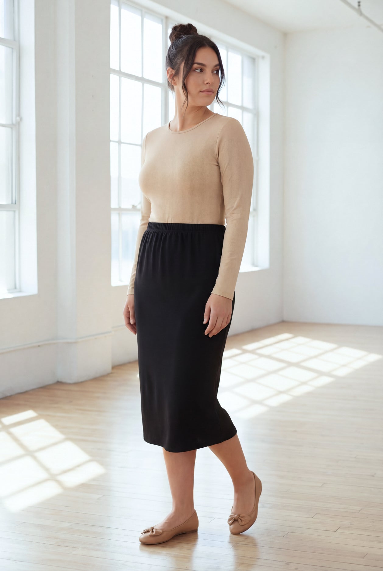 Model wearing Nuggles® 31" Classic Skirt in Black