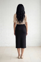 Model wearing Nuggles® 31" Relaxed Midi Skirt in Black